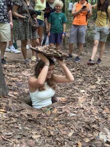 Experiencing secret entrance in Cu Chi tunnel