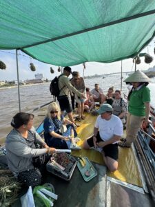 Local woman paddling at Cai Rang floating market – Mekong Delta