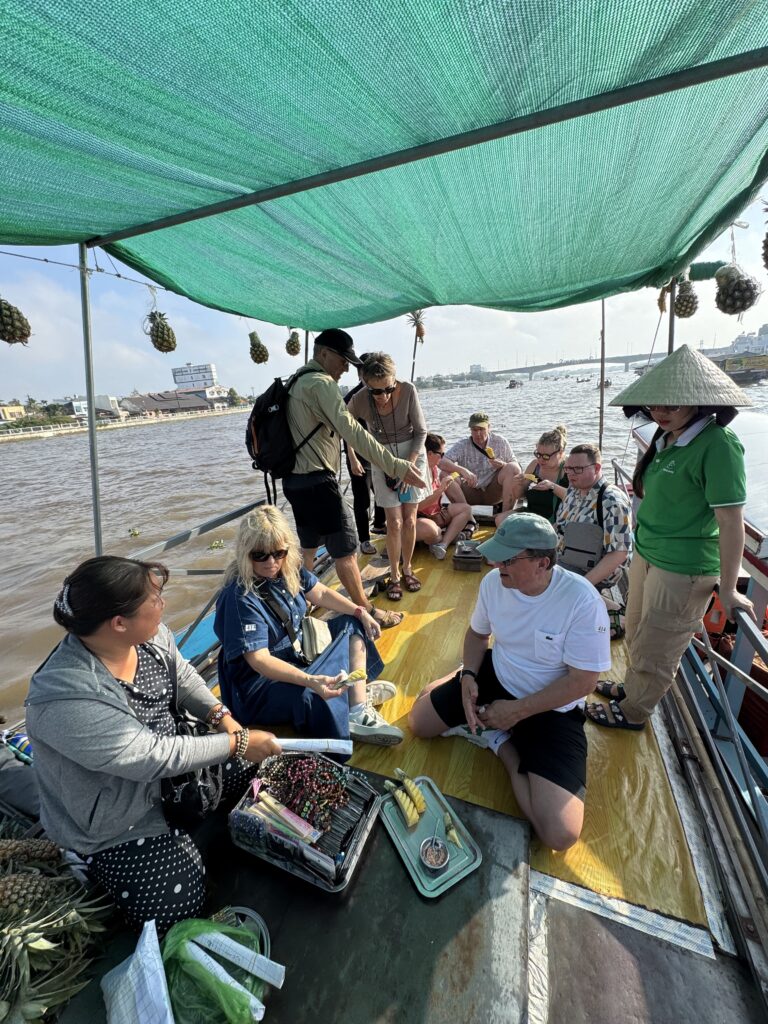 Local woman paddling at Cai Rang floating market – Mekong Delta