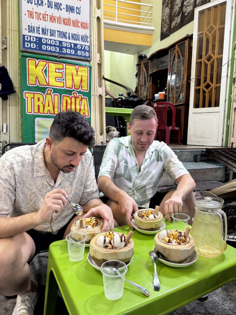 Saigon street food vendor serving local dishes at night